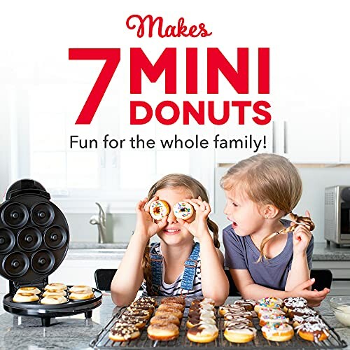 Two children enjoying mini donuts with a donut maker in the kitchen.