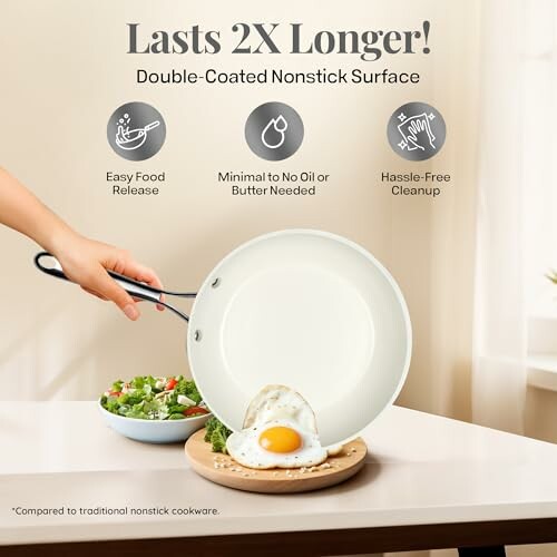 Person cooking egg on nonstick pan with salad on table.