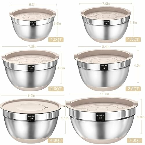 Set of stainless steel mixing bowls with lids in various sizes.