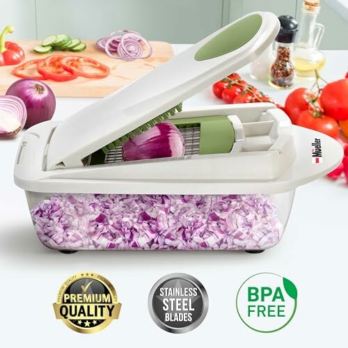 Vegetable chopper slicing onions with stainless steel blades, surrounded by cut vegetables and kitchen items.